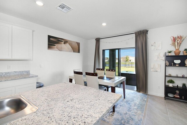 view of tiled dining space