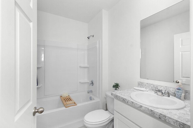 full bathroom with vanity, toilet, and shower / washtub combination