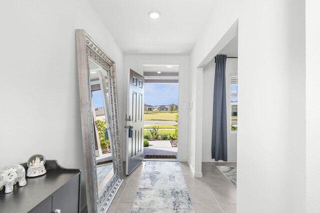 entrance foyer with light tile patterned floors