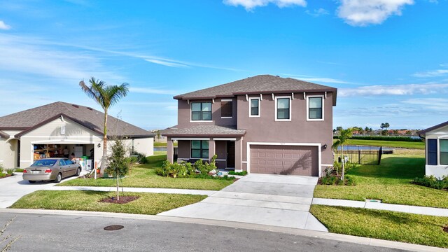 view of front of house with a front lawn and a garage