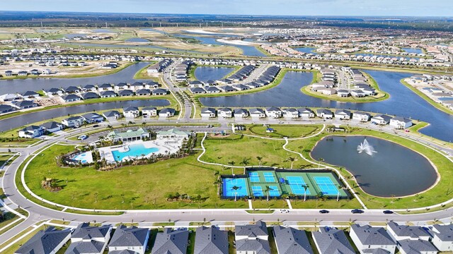 birds eye view of property with a water view