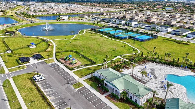 birds eye view of property with a water view