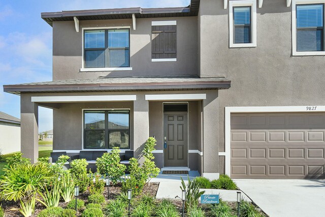 view of front of property featuring a garage