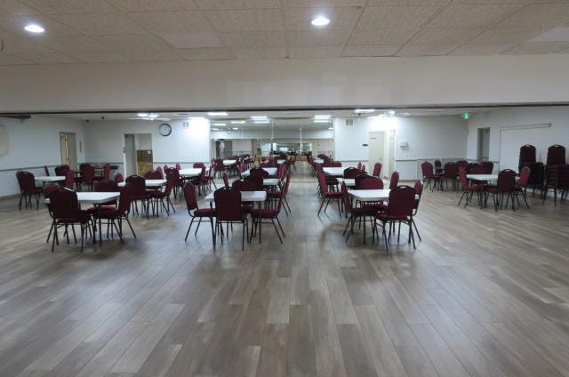 dining room featuring a drop ceiling and wood-type flooring