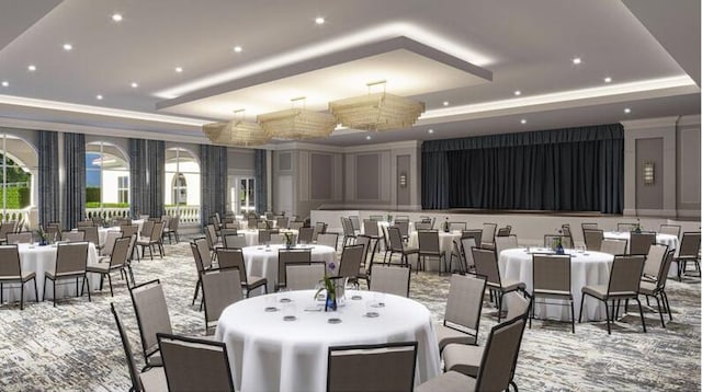 carpeted dining space with a tray ceiling