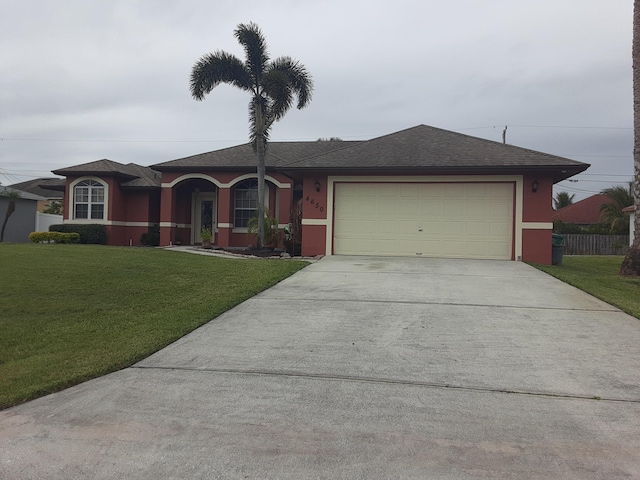 ranch-style house with a garage and a front yard