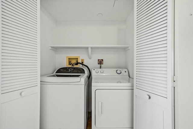 laundry room with separate washer and dryer