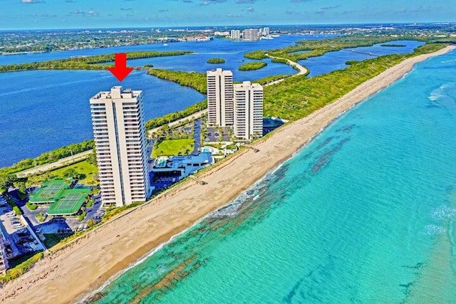 bird's eye view with a water view and a view of the beach