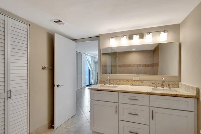 bathroom with vanity and tile patterned floors