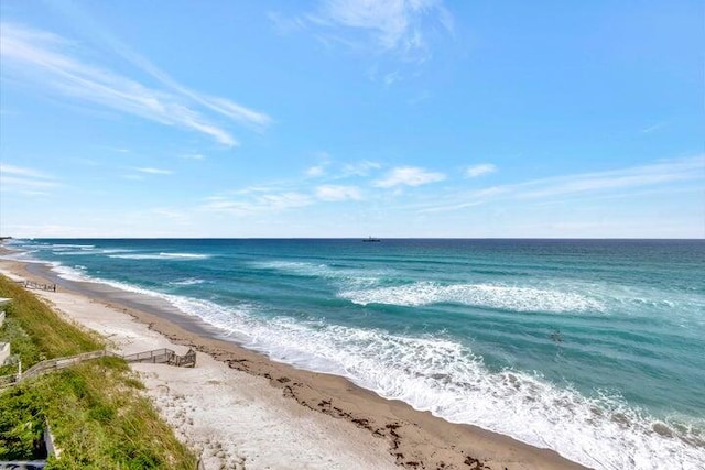 view of water feature with a beach view