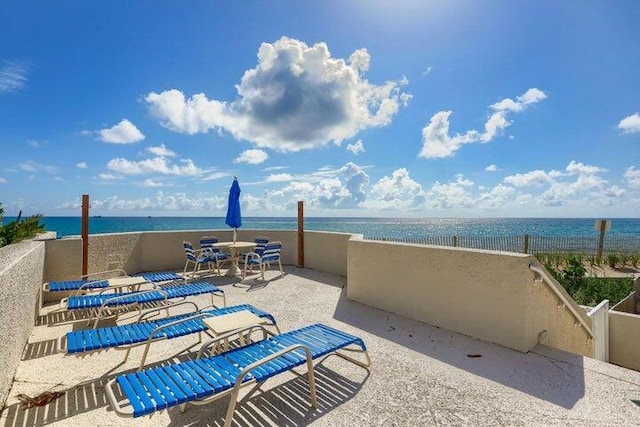 view of patio featuring a water view