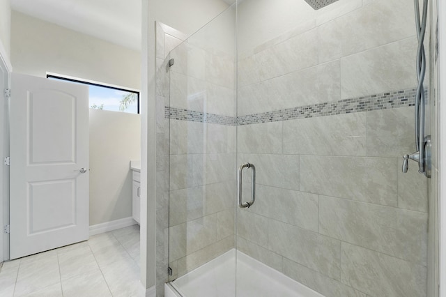 bathroom with vanity, a shower stall, and tile patterned flooring