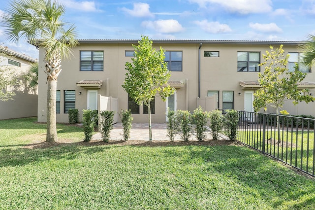 view of front of home featuring a patio area and a front lawn