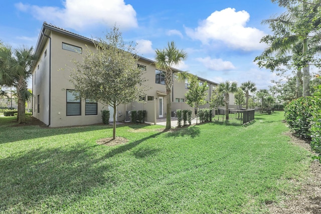 view of yard featuring central air condition unit, a patio area, and fence