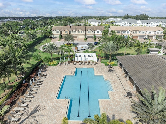 pool featuring a residential view and a patio area