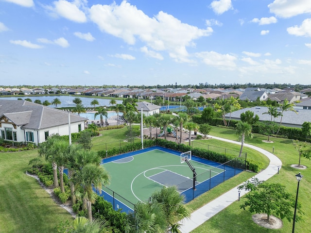 drone / aerial view with a residential view and a water view