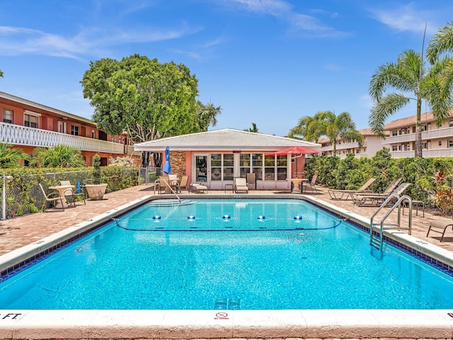 view of swimming pool with a patio area