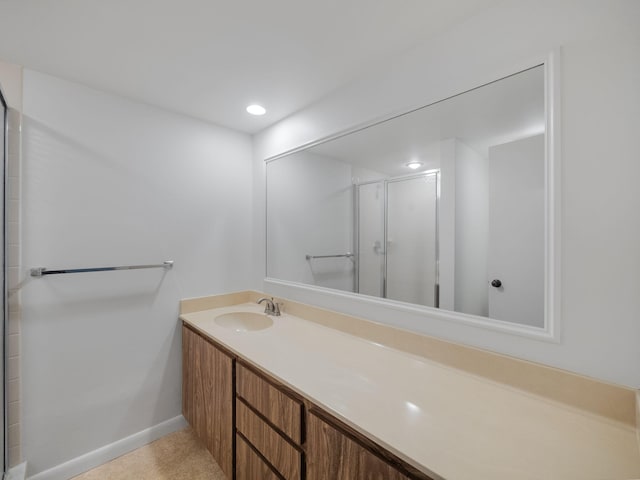 bathroom with vanity and an enclosed shower