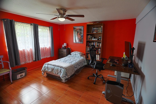 bedroom with wood-type flooring and ceiling fan