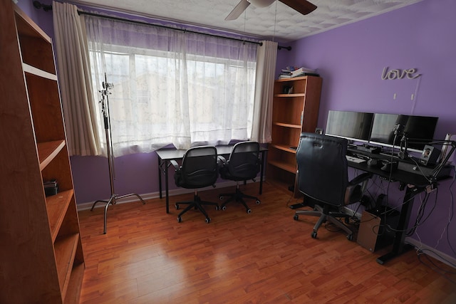 office with ceiling fan, hardwood / wood-style floors, and a textured ceiling