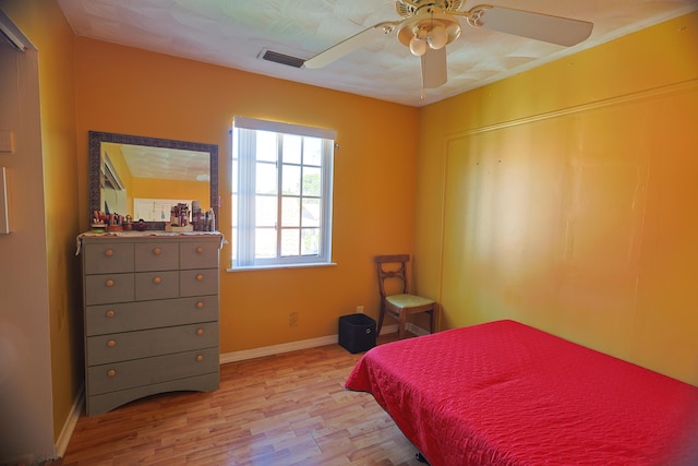 bedroom featuring ceiling fan and light hardwood / wood-style flooring