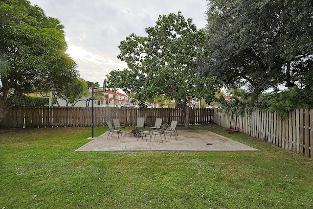 view of yard featuring a patio area and an outdoor fire pit