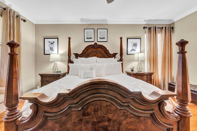 bedroom featuring crown molding and wood-type flooring