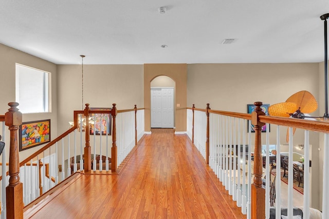 corridor with light wood-type flooring