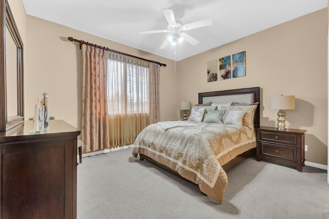 bedroom featuring ceiling fan and light colored carpet