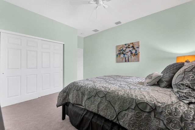 carpeted bedroom featuring a closet and ceiling fan