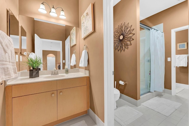 bathroom with curtained shower, tile patterned flooring, vanity, and toilet