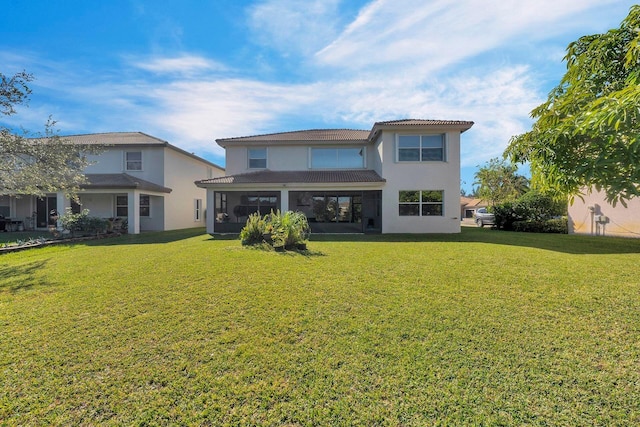 rear view of house with a lawn