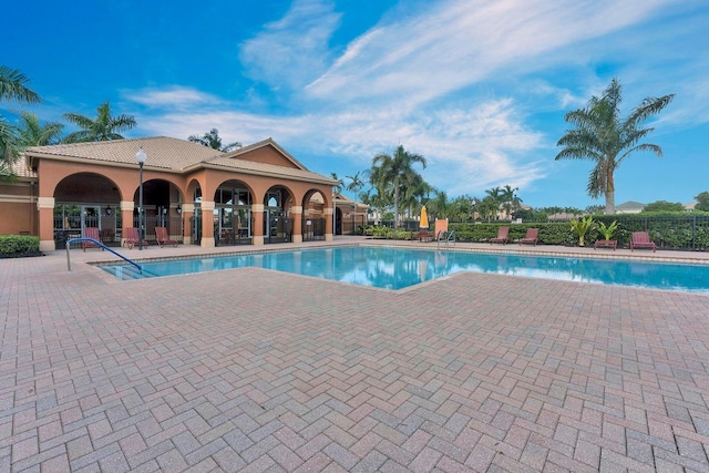 view of swimming pool with a patio