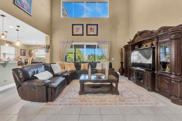 tiled living room featuring a high ceiling