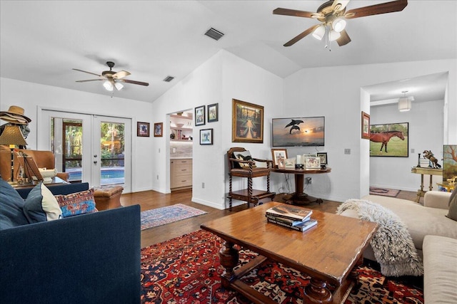 living room with french doors, vaulted ceiling, ceiling fan, and wood-type flooring