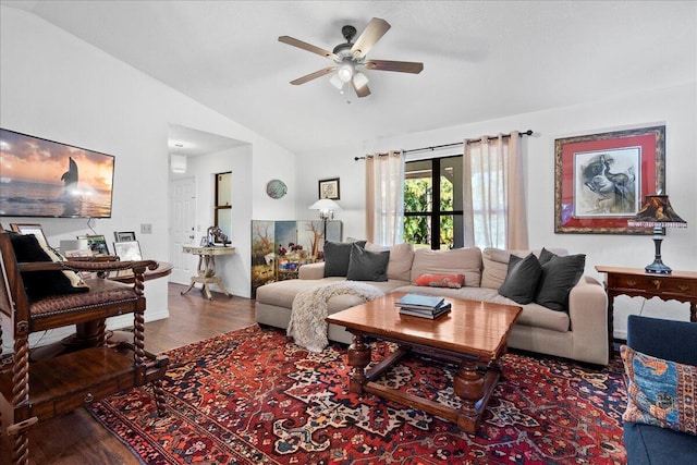 living room featuring ceiling fan, wood-type flooring, and vaulted ceiling