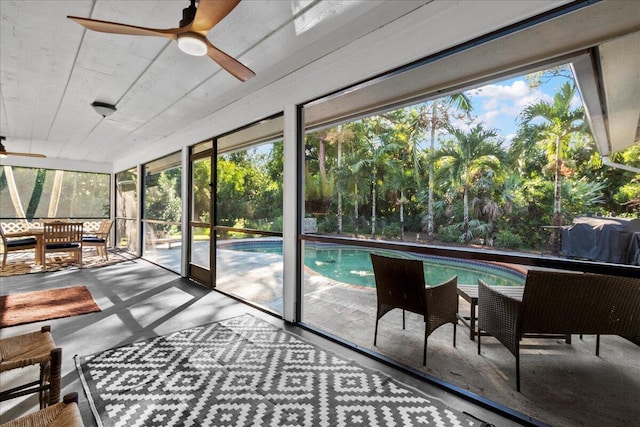 sunroom / solarium with ceiling fan and plenty of natural light