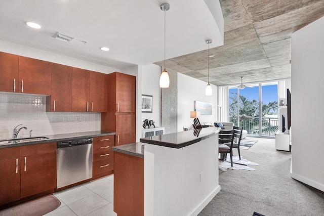 kitchen featuring dishwasher, light carpet, sink, tasteful backsplash, and decorative light fixtures