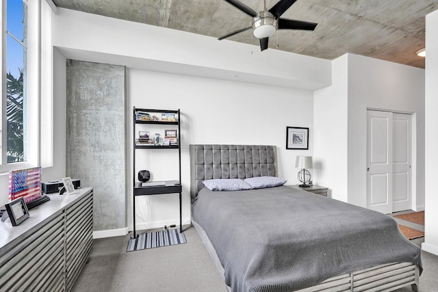 carpeted bedroom with ceiling fan