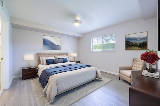 bedroom featuring ceiling fan and light hardwood / wood-style flooring