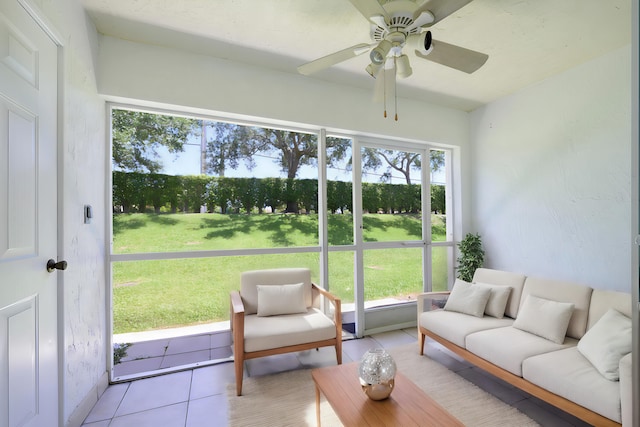 sunroom featuring ceiling fan