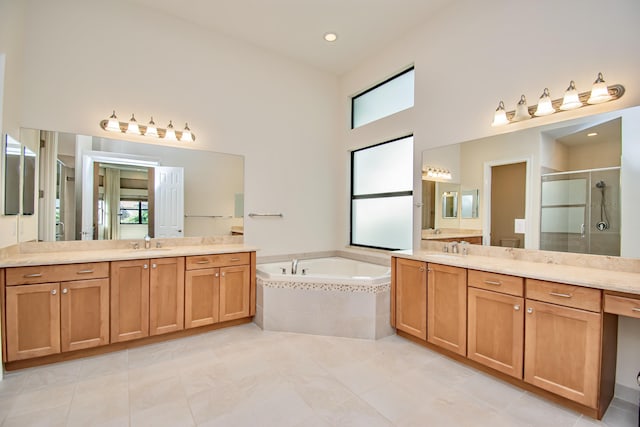 bathroom with vanity, tile patterned floors, and separate shower and tub