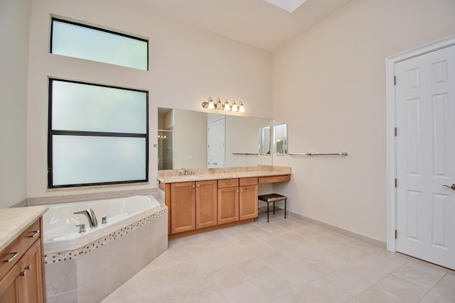 bathroom with vanity, separate shower and tub, and tile patterned floors