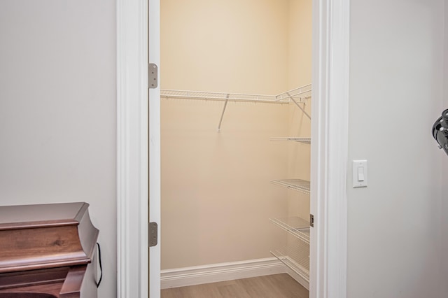 walk in closet featuring light hardwood / wood-style floors