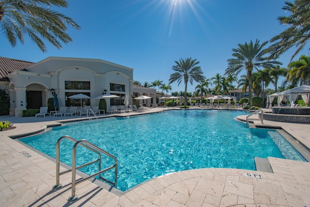 view of swimming pool with a patio area