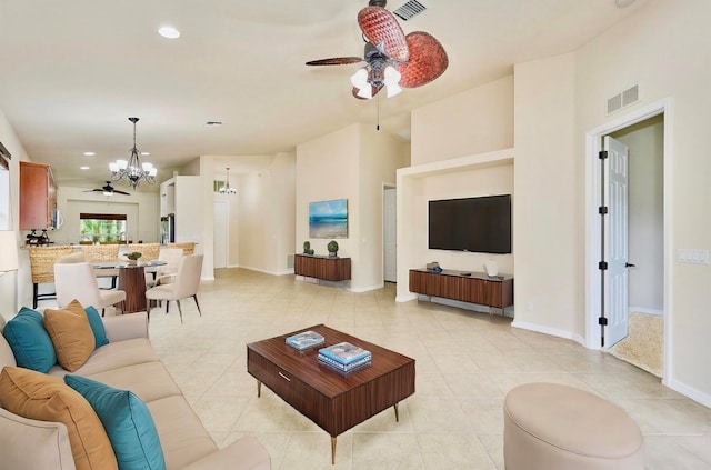 living room featuring light tile patterned floors and an inviting chandelier