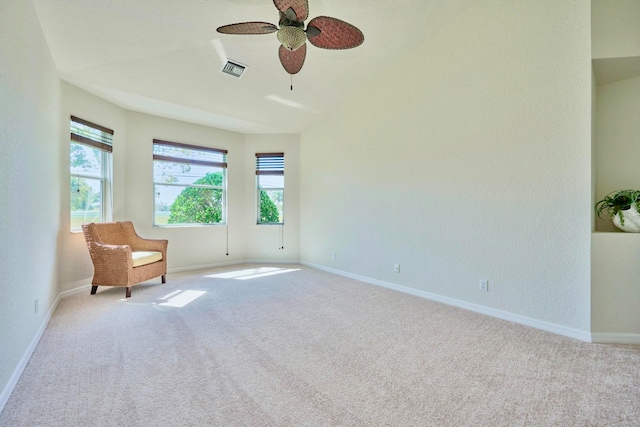 unfurnished room with ceiling fan and light colored carpet