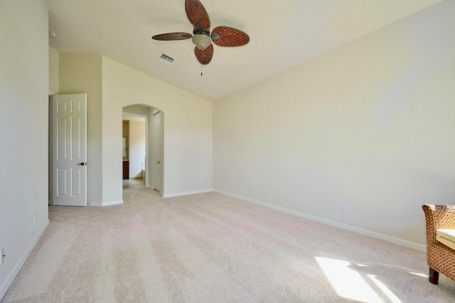 interior space featuring light carpet, vaulted ceiling, and ceiling fan