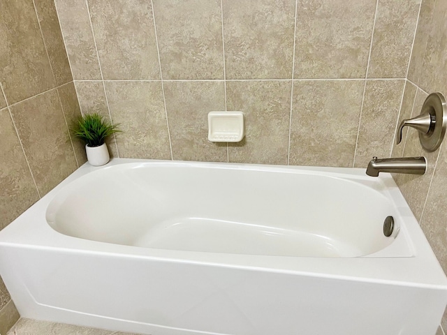 bathroom with tile walls