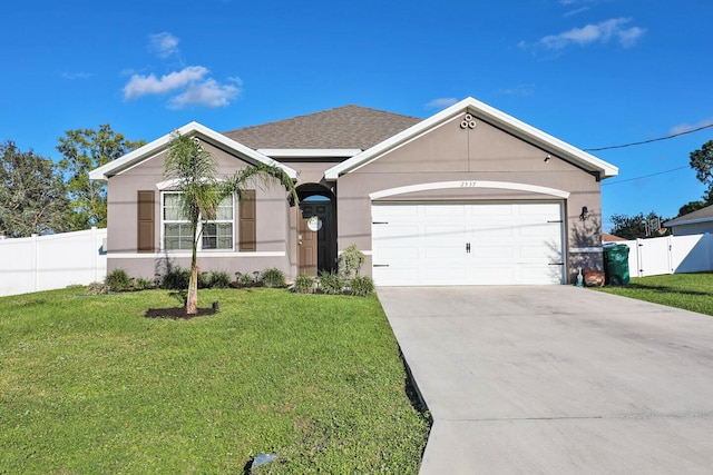 single story home featuring a garage and a front yard